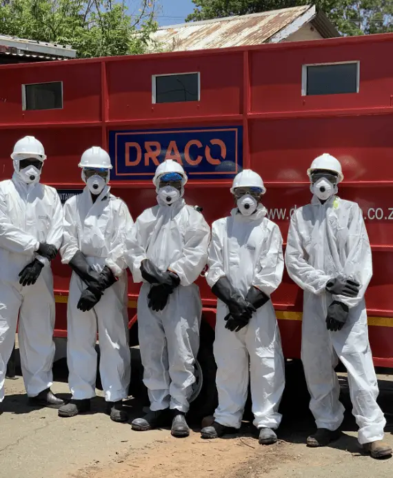 A Draco Group Team in front of a Draco Group trailer