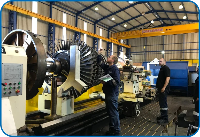 Technicians inspecting a turbo machine